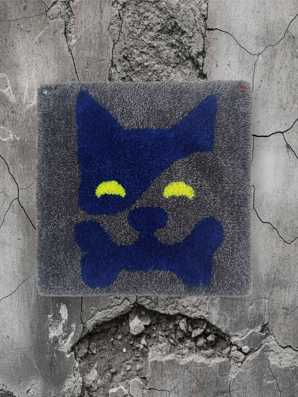 Hand-tufted navy blue dog rug with glowing eyes and a bone, 35x35 cm, handmade in Spain by VTTTF