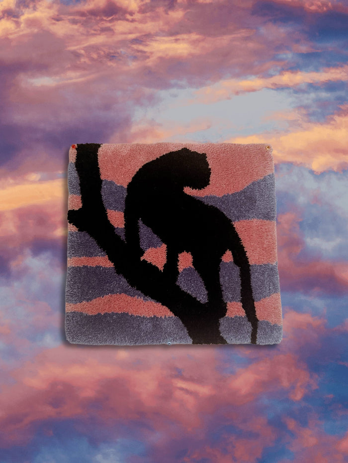 Hand-tufted black panther rug on an orange and violet sunset, 35x35 cm, handmade in Spain by VTTTF